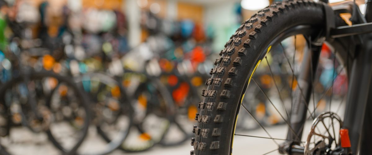 bicycle-in-sports-shop-focus-on-front-wheel-DR7MFHK